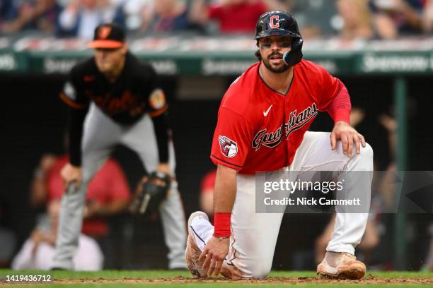 Austin Hedges of the Cleveland Guardians scores on a two-run double by Steven Kwan during the fifth inning against the Baltimore Orioles at...