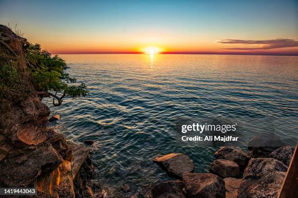 sunset scene by lake erie - eriesee stock-fotos und bilder