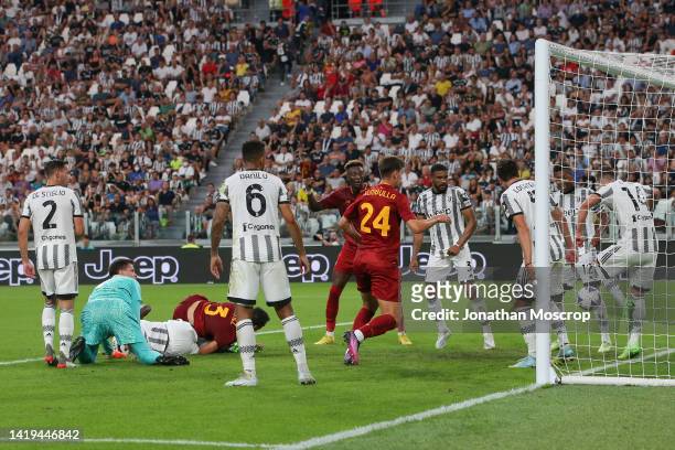 Tammy Abraham and Marash Kumbulla of AS Roma close in as Arkadiusz Milik of Juventus clears the ball off the goalline as his team mates Mattia De...