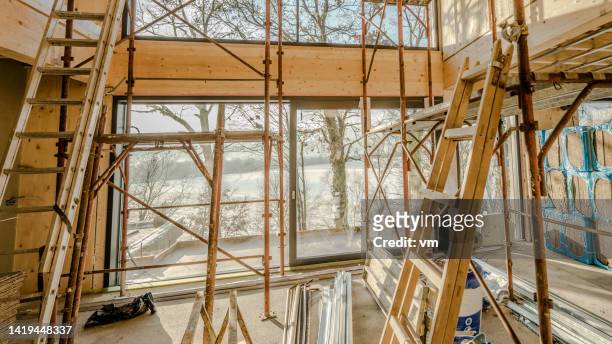 modern wooden house construction, big room at daylight - general construction stock pictures, royalty-free photos & images