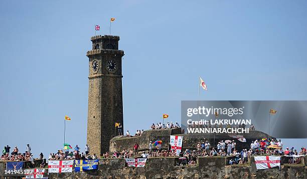 England cricket team fans watch the second day of the opening Test Match between Sri Lanka and England from the top of the 14th century Dutch fort...