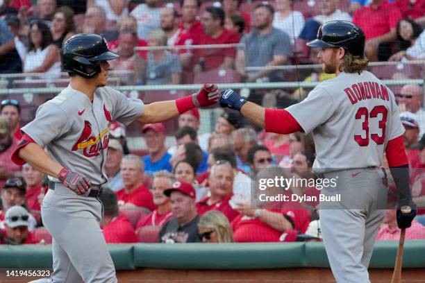 Tommy Edman of the St. Louis Cardinals celebrates his solo home run with Brendan Donovan in the third inning against the Cincinnati Reds at Great...