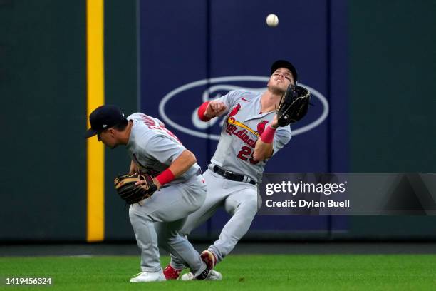 Corey Dickerson of the St. Louis Cardinals catches a fly ball behind Tommy Edman in the fourth inning against the Cincinnati Reds at Great American...