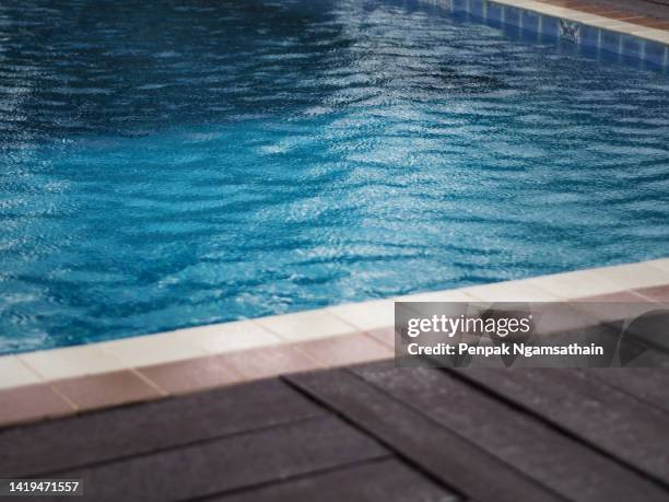 wave water blue color in swimming pool - poolside stock-fotos und bilder