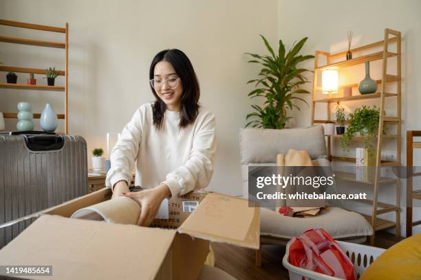 university student packing up belongings on moving day. - college preparation stock pictures, royalty-free photos & images