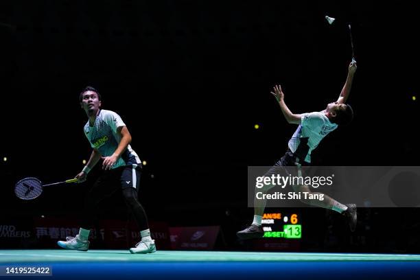 Mohammad Ahsan and Hendra Setiawan of Indonesia compete in the Men's Doubles First Round match against Kang Min Hyuk and Seo Seung Jae of Korea...