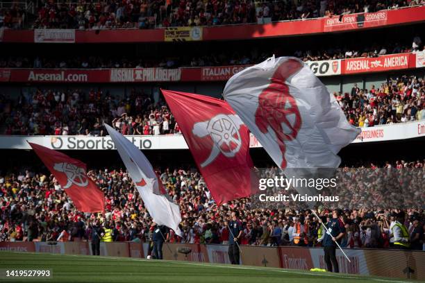 Arsenal flag wavers prior to the Premier League match between Arsenal FC and Fulham FC at Emirates Stadium on August 27, 2022 in London, England.