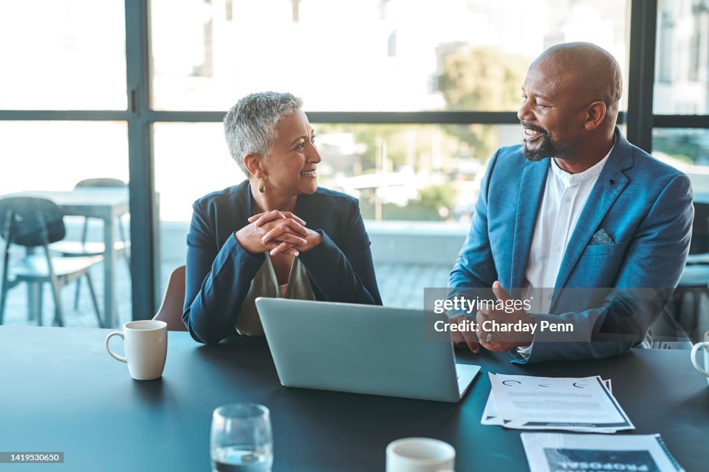 Leadership, management and teamwork between CEO and senior manager in a business meeting in the office. Leader and boss working as a team to plan the vision and mission for growth and development