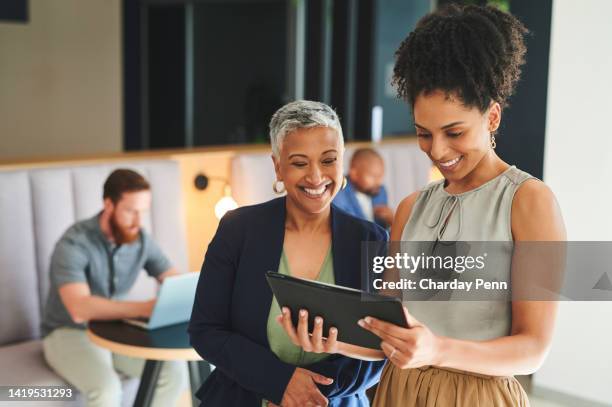 planning, strategy and development with a business woman and her female leader, manager or ceo talking with a tablet about company mission and vision. growth, development and teamwork in a startup - live stage stockfoto's en -beelden