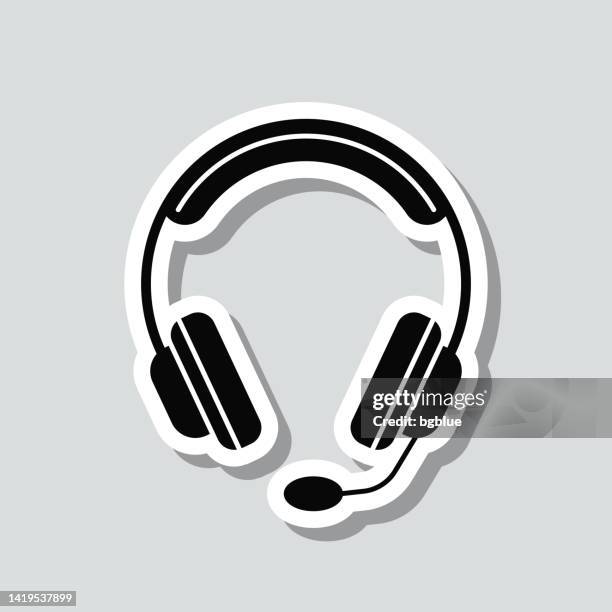 headset. symbolaufkleber auf grauem hintergrund - in ear headphones stock-grafiken, -clipart, -cartoons und -symbole