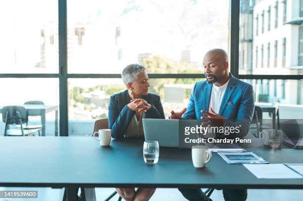 business, presentation and man on a laptop in a corporate conference or office collaboration with a woman at work. businessman, manager or coach for marketing, strategy and sales working with ceo. - enterprise imagens e fotografias de stock