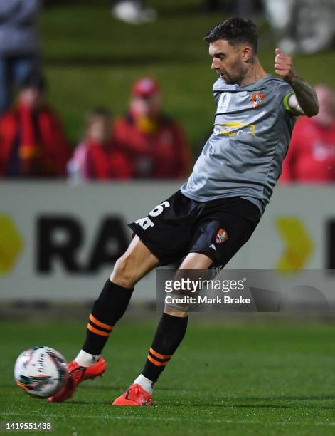 James O'Shea of the Brisbane Roar shoots for goal and scores his teams first goal during the Australia Cup Quarter Final match between Adelaide...