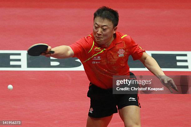 Ma Lin of China plays a forehand during his match against Joergen Persson of Sweden during the LIEBHERR table tennis team world cup 2012 championship...