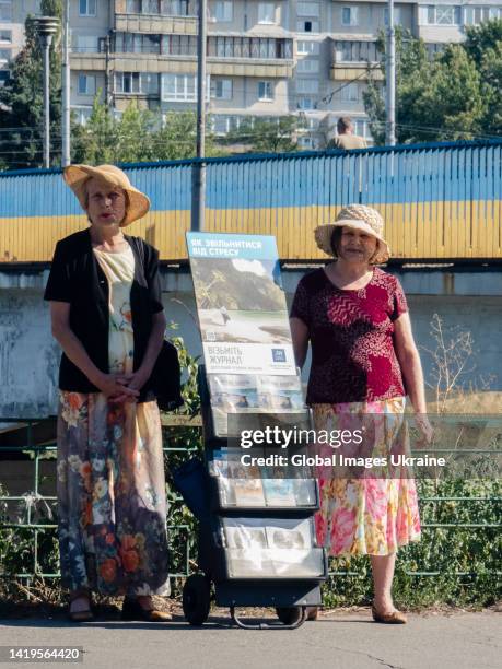 Members of Jehovah’s Witnesses offer their religious magazines on the embankment of the Rusanivskyi Canal on July 28, 2022 in Kyiv, Ukraine. The...