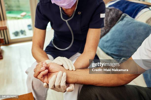 nurse and patient at home - female nurse stock pictures, royalty-free photos & images