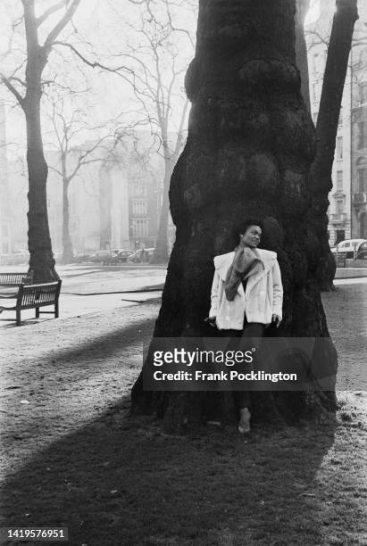 American actress and singer, Eartha Kitt in Berkeley Square, London, 24th January 1957. Original Publication: Picture Post - 8817 - The Heart Of That...