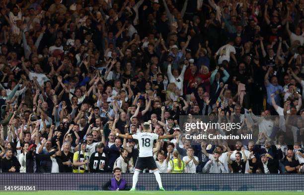 Andreas Pereira of Fulham celebrates infront of the fan during the Premier League match between Fulham FC and Brighton & Hove Albion at Craven...