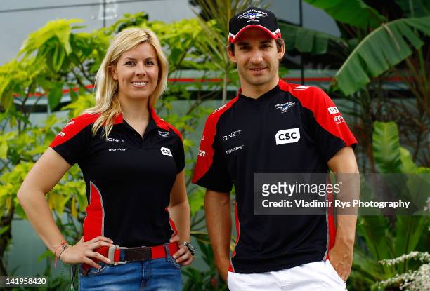 Timo Glock of Germany and Marussia poses for a photo with Maria de Villota ahead of practice for the Formula One Grand Prix of Malaysia at Sepang...