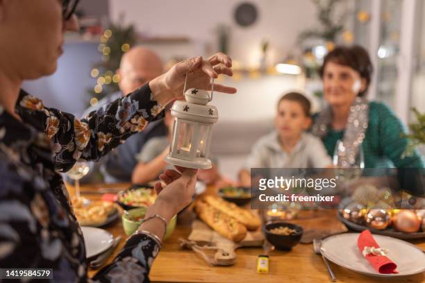 family gathered for the christmas dinner - serbia tradition stock pictures, royalty-free photos & images