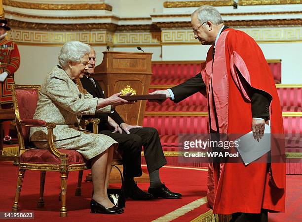 Queen Elizabeth II accompanied by Prince Philip, Duke of Edinburgh receives a copy of the loyal address from the Chancellor of Cambridge University...