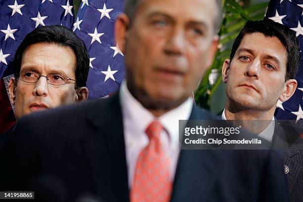 House Majority Leader Eric Cantor and House Budget Committee Chairman Paul Ryan listen to Speaker of the House John Boehner as they hold a brief news...