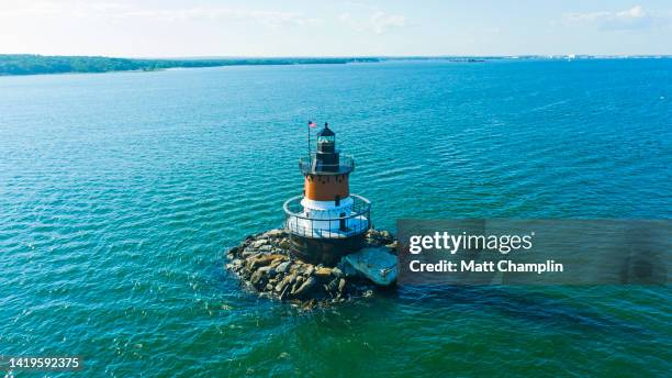 aerial of lighthouse and bridge in jamestown, rhode island - leuchtturm schiff stock-fotos und bilder