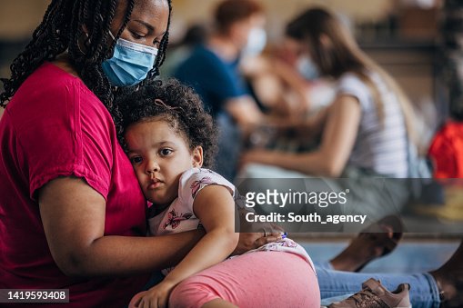 Mother and child in shelter after natural disaster