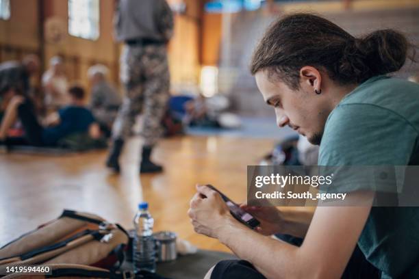 man in shelter after natural disaster - resident stock pictures, royalty-free photos & images