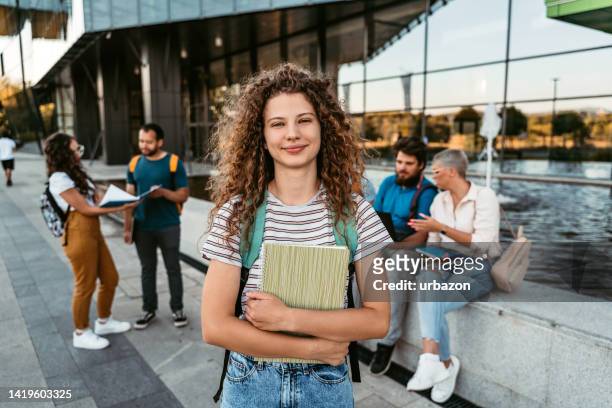 beautiful smiling female college student - study abroad stock pictures, royalty-free photos & images