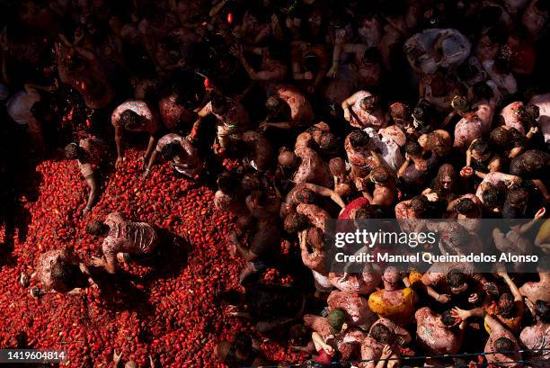 Revellers enjoy the atmosphere while participating the annual Tomatina festival on August 31, 2022 in Bunol, Spain. The world's largest food fight...