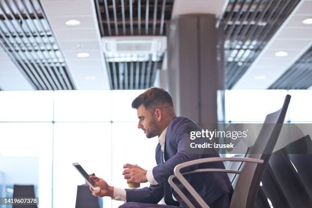 businessman waiting for the flight - white jacket stock pictures, royalty-free photos & images