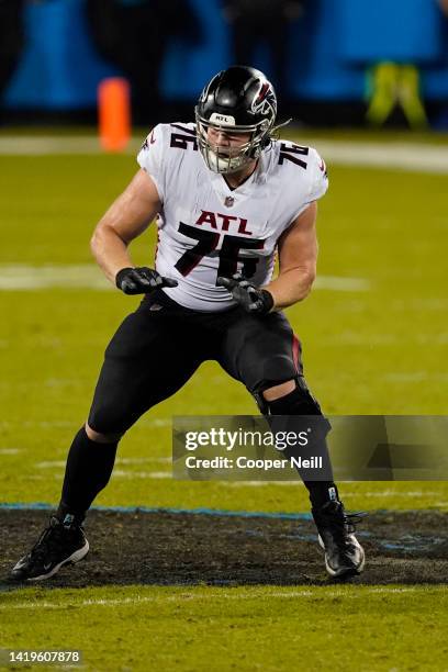 Kaleb McGary of the Atlanta Falcons protects the passer during an NFL game against the Carolina Panthers at Bank of America Stadium Stadium on...