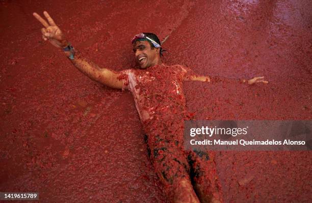 Revellers enjoy the atmosphere in tomato pulp while participating the annual Tomatina festival on August 31, 2022 in Bunol, Spain. The world's...