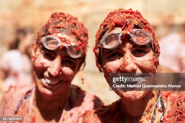 Revellers enjoy the atmosphere in tomato pulp while participating the annual Tomatina festival on August 31, 2022 in Bunol, Spain. The world's...