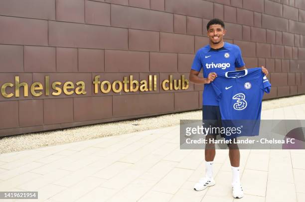 Wesley Fofana poses for a photograph as he signs for Chelsea at Chelsea Training Ground on August 31, 2022 in Cobham, England.