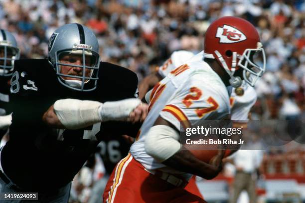 Raiders LB Ted Hendricks moves to tackle Chiefs FB Theotis Brown during game action of Los Angeles Raiders vs. Kansas City Chiefs, October 9, 1983 in...