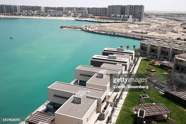 The Al Muneera, bottom, and Al Zeina, top, property developments are seen during a media tour organized by Aldar Properties PJSC, Abu Dhabi's biggest...