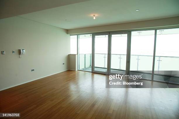 The living room of an empty apartment is seen at the Al Rabha property development during a media tour organized by Aldar Properties PJSC, Abu...