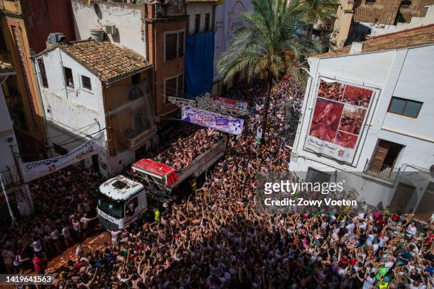 One of the trucks full of tomatoes arrives at the town hall square with tomatoes to throw at the participants of the Tomatina festival on August 31,...