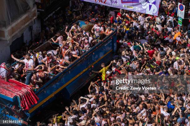 One of the trucks full of tomatoes arrives at the town hall square with tomatoes to throw at the participants of the Tomatina festival on August 31,...