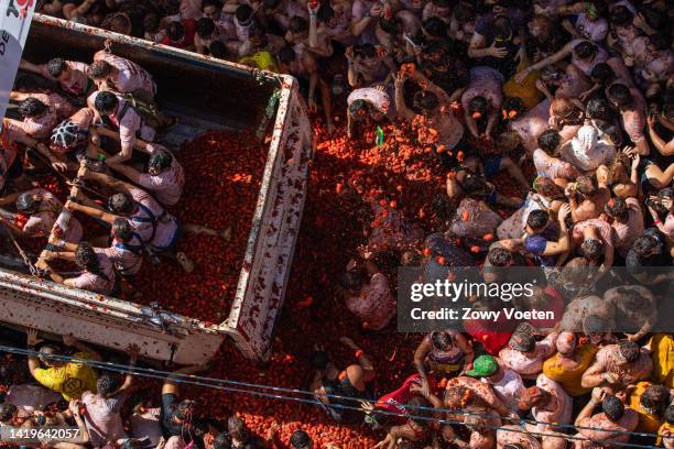 One of the trucks full of tomatoes arrives at the town hall square to throw tomatoes to the participants of the event on August 31, 2022 in Bunol,...