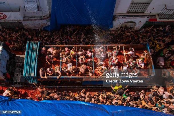 One of the trucks full of tomatoes arrives at the town hall square with tomatoes to throw at the participants of the Tomatina festival on August 31,...