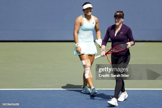 Madison Brengle of the United States and Claire Liu of the United States react to a point against Nicole Melichar-Martinez of the United States and...