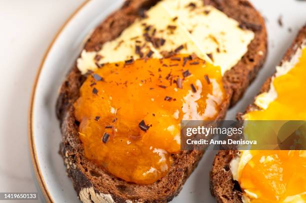 chocolate bread and apricot jam - marmalade sandwich stock pictures, royalty-free photos & images