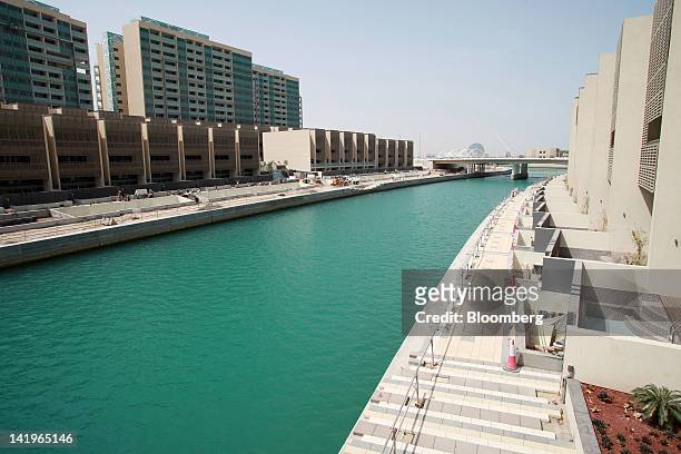 New apartment blocks are seen beside a waterway at the Al Muneera development during a media tour organized by Aldar Properties PJSC, Abu Dhabi's...