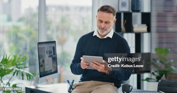 business man, manager and seo expert planning online with digital tablet, internet and app technology in a startup agency. mature company leader and entrepreneur working on strategy in an office - search engine optimisation stockfoto's en -beelden
