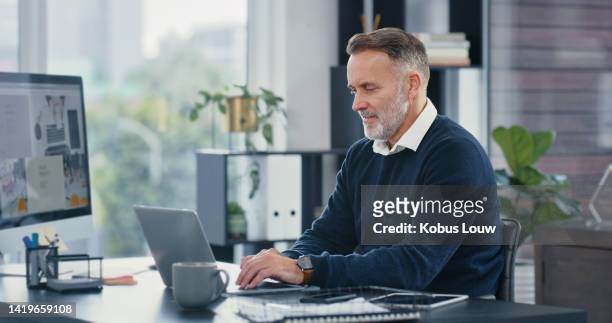 mature ceo, typing and working on laptop in his office. corporate business man busy using computer to email colleagues. committed and professional worker uses tech for efficient communication. - writing email stock pictures, royalty-free photos & images