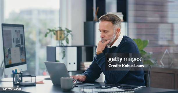 corporate accountant working on a laptop and computer doing accounting research in a modern office. businessman analyzing stocks, stats and finance economy to create financial freedom with technology - auditing bildbanksfoton och bilder