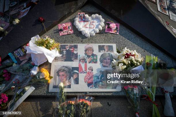 Flowers, photographs and messages to Diana, Princess of Wales, are left at the Liberty Flame above the Pont de l'Alma, the unofficial memorial to...