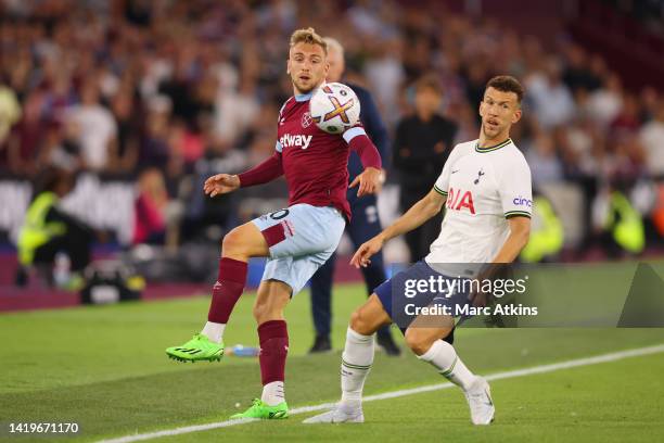 Jarrod Bowen of West Ham United is marked by Ivan Perisic of Tottenham Hotspur during the Premier League match between West Ham United and Tottenham...